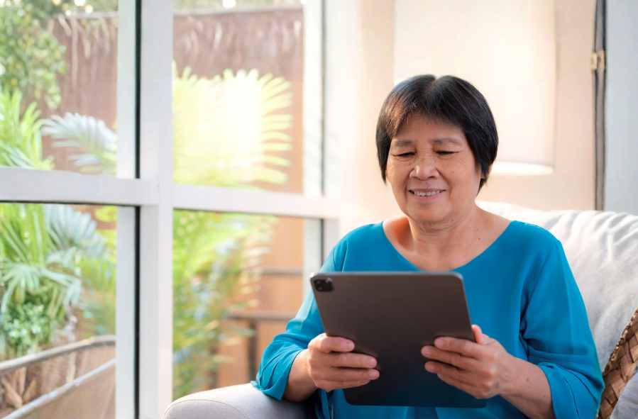 SIBH woman on a tablet